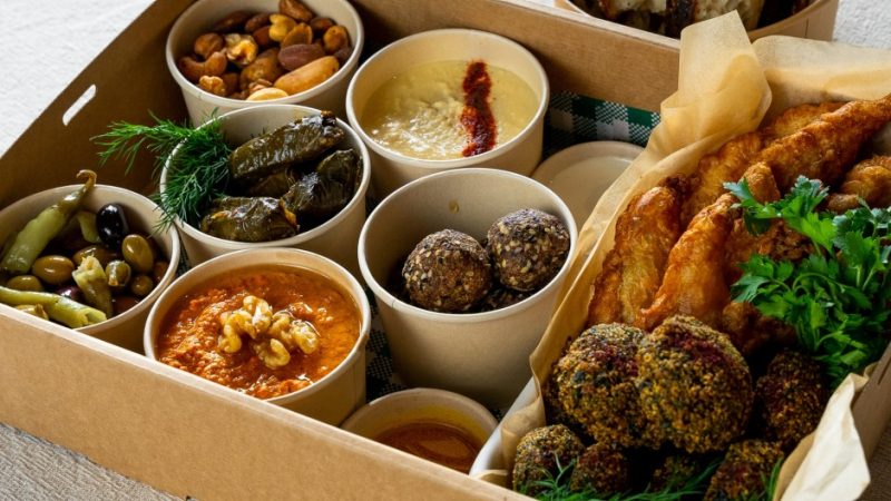 Picnic baskets can be filled with high-quality platters, dips, and pies